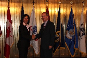 Col. Joyce Jenkins-Harden, USAF (Ret.), chapter vice president, recognizes the October luncheon speak, Dr. J. Douglas Beason, chief scientist and technology adviser, Headquarters Air Force Space Command.